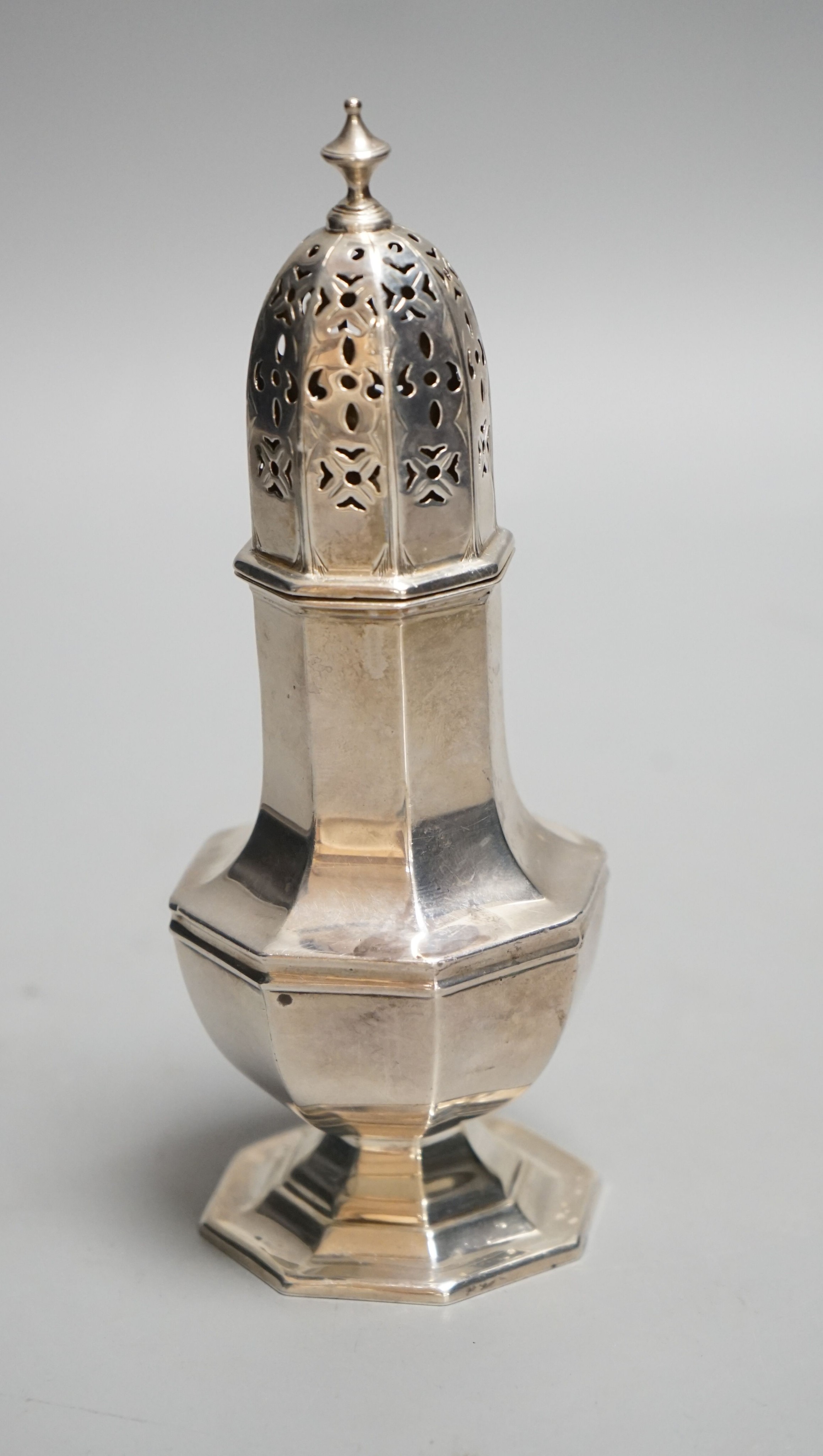 A George V silver octagonal sugar caster, Birmingham, 1910, 15.4cm, 93 grams.